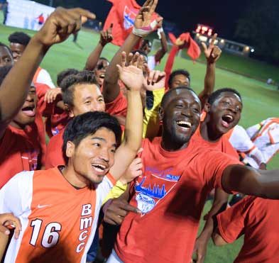 students cheering at soccer game