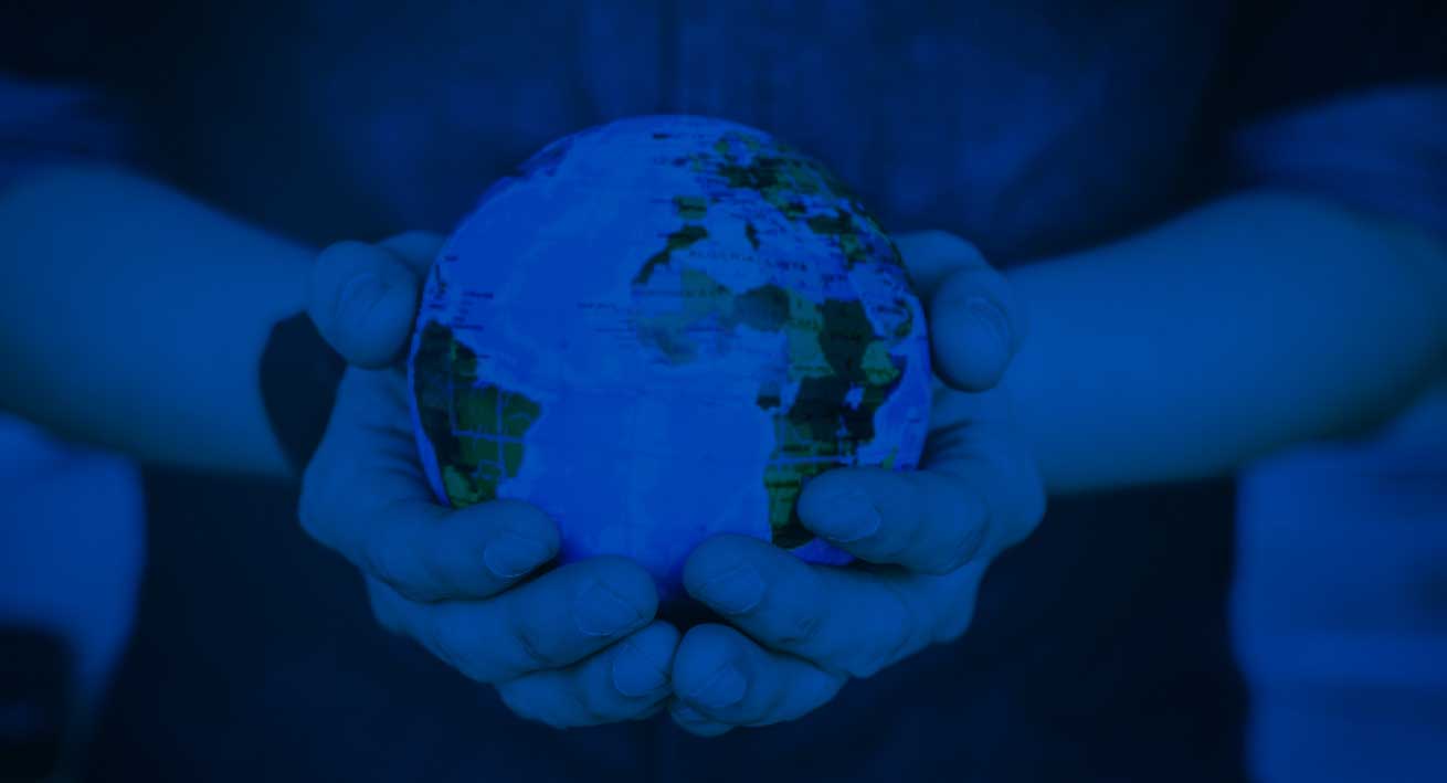 hands holding globe